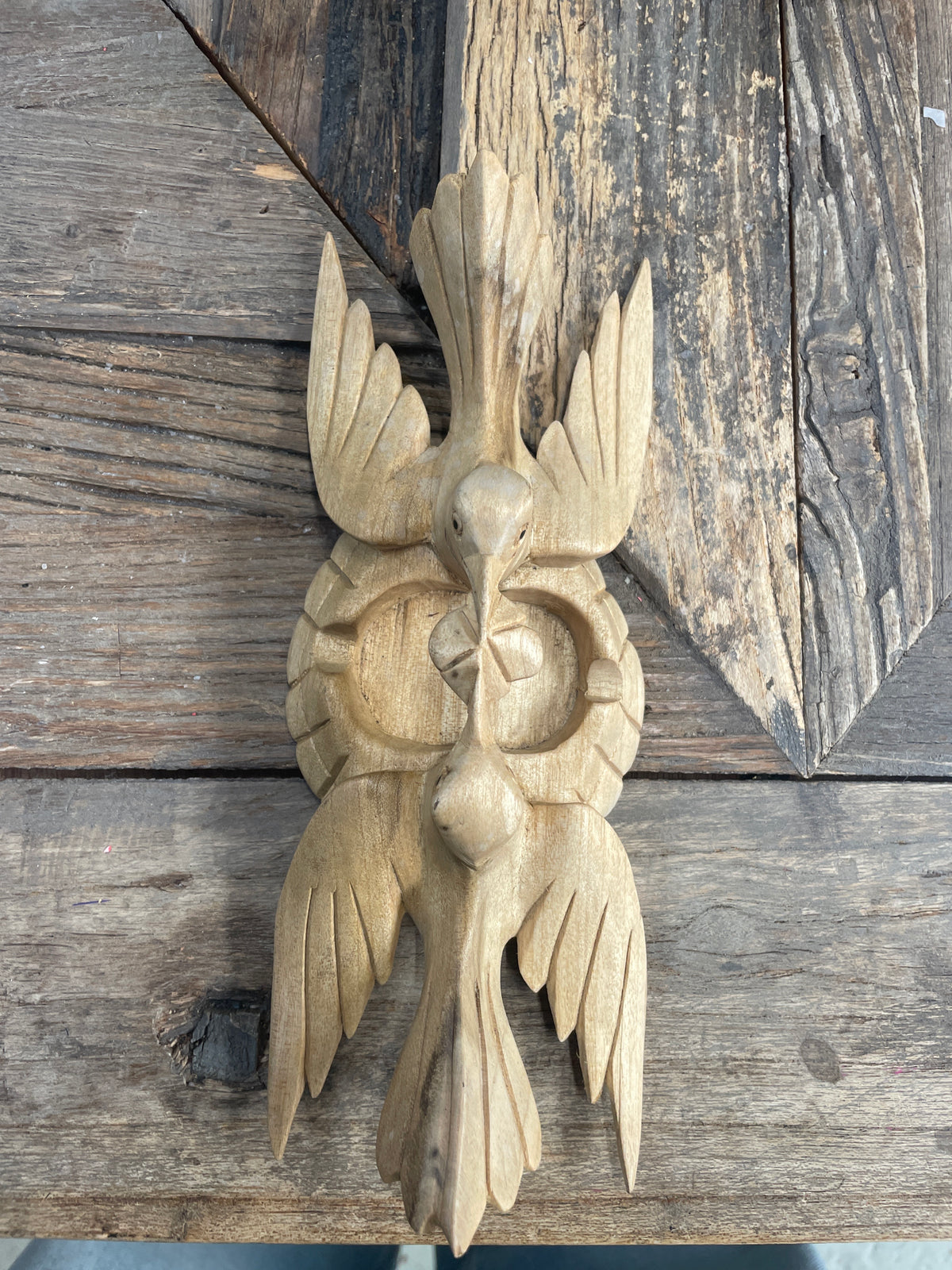 Koppeltje houtsnijwerk vogels
